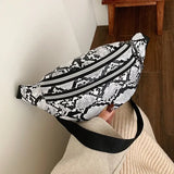 Käärmeennahkainen vyölaukku