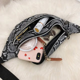 Käärmeennahkainen vyölaukku