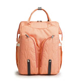 Laajennettava hoitolaukku sängyllä Oranssi