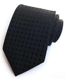 Musta solmio pilkulla