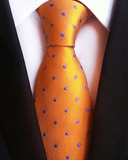 Oranssi pilkullinen solmio