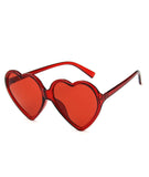 Sydämenmuotoiset aurinkolasit Punainen
